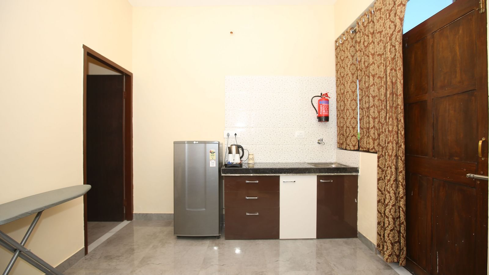 Studio Villa room equipped with a mini-fridge, a sink cupboard, and a kettle at Aanandam Resort & Spa