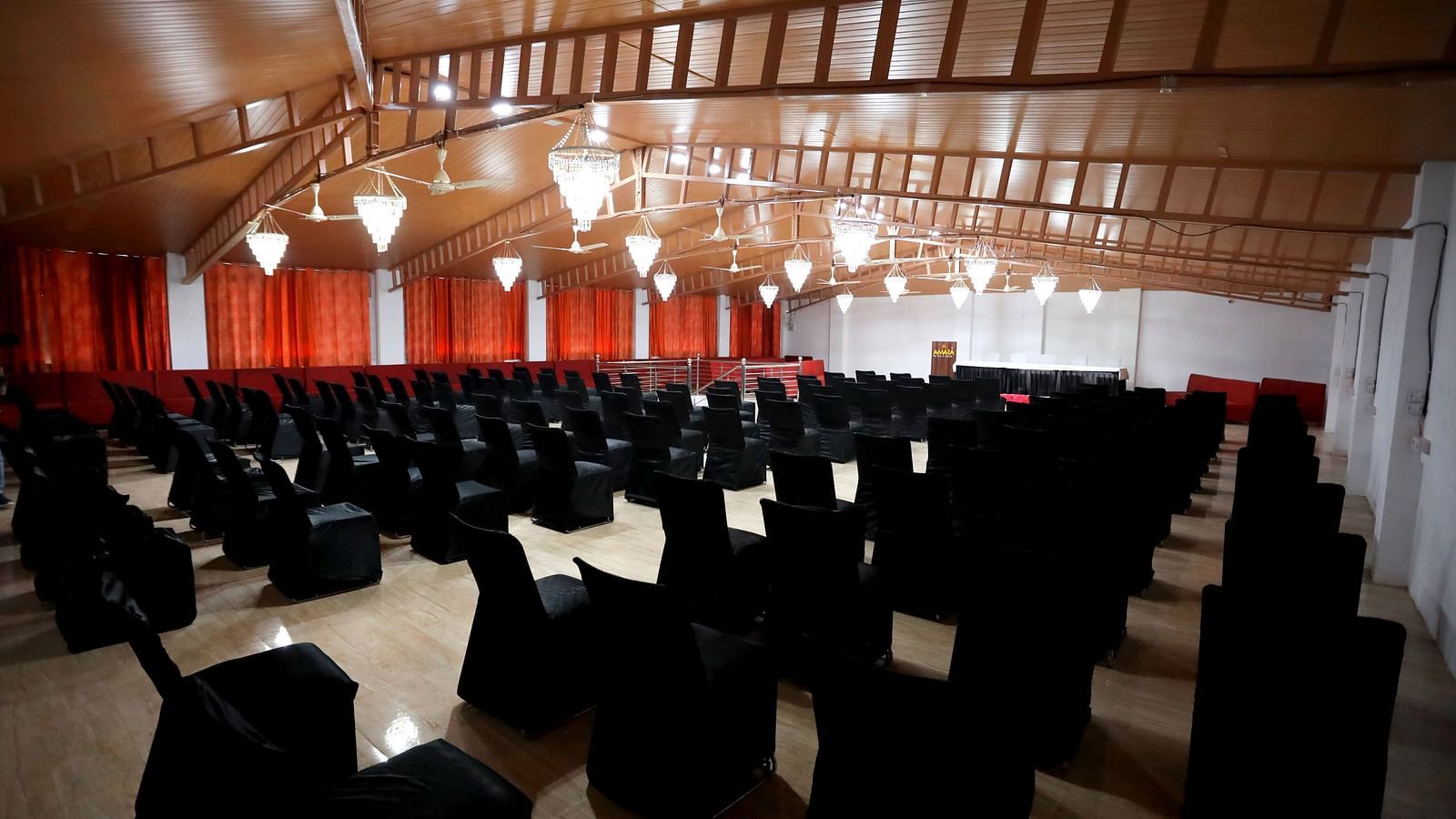 Image of an events space with chairs and a slated roof at Amara Hill Queen, Mussoorie.