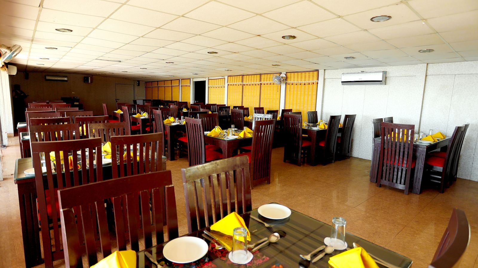 Image of a table with napkins arranged on the table at Amara Hill Queen, Mussoorie.