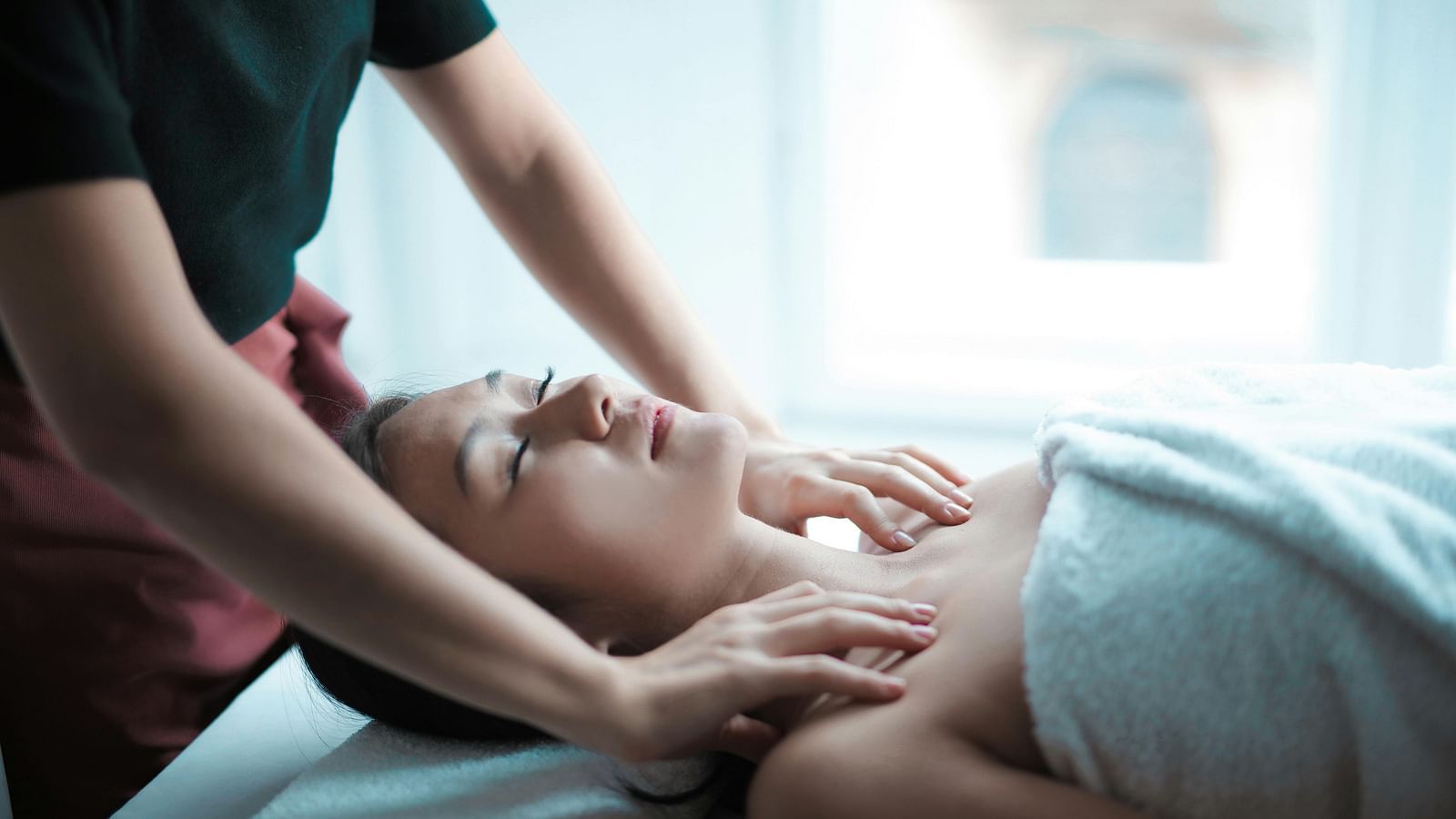 A woman getting a massage at the spa