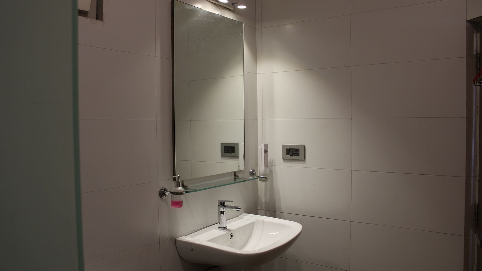 Image of the handwash area with wall mirror at Arcadia Heritage Resort, Darjeeling