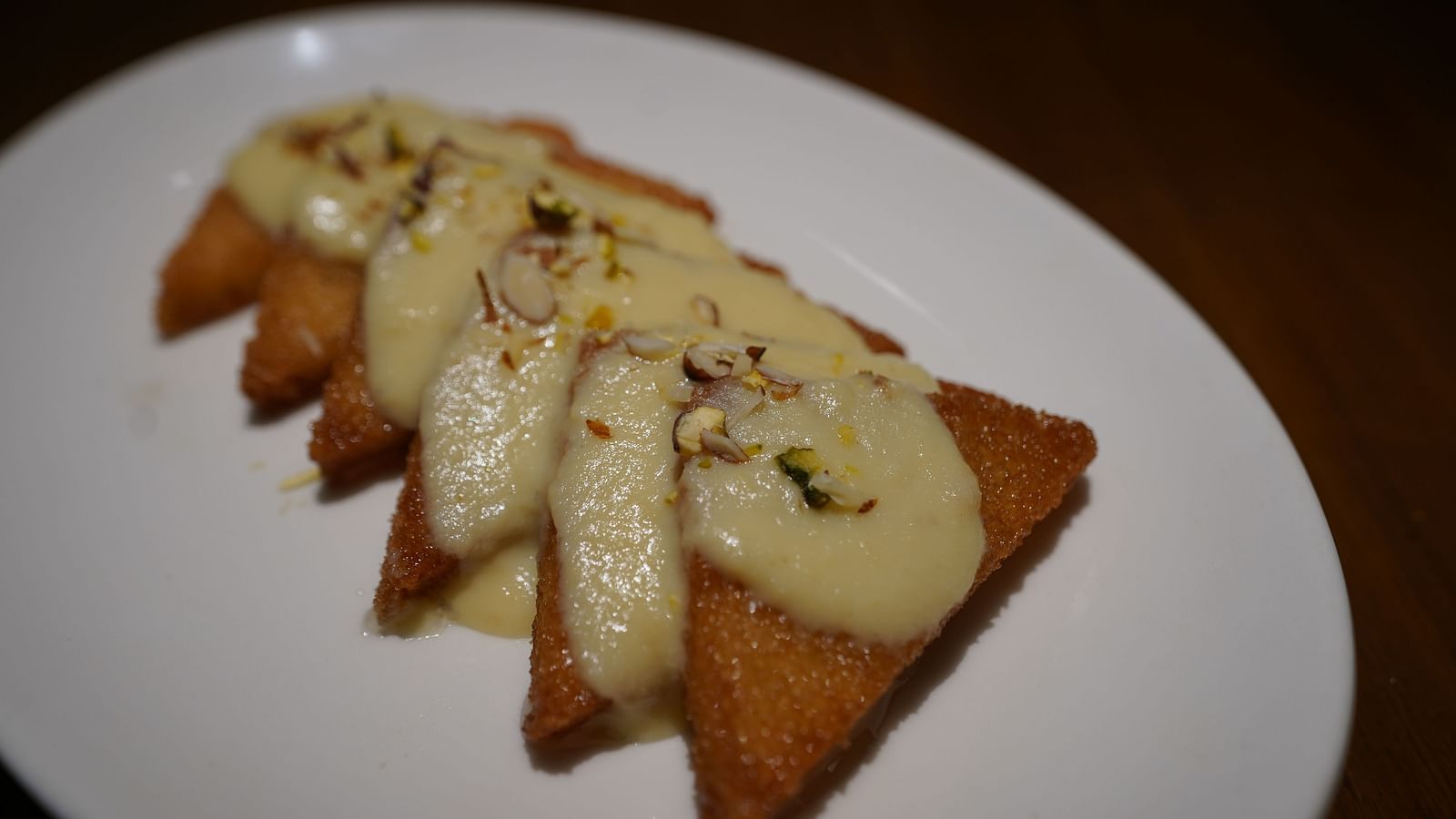 An image of a fritters decorated on platter - Argo By Trance, Goa