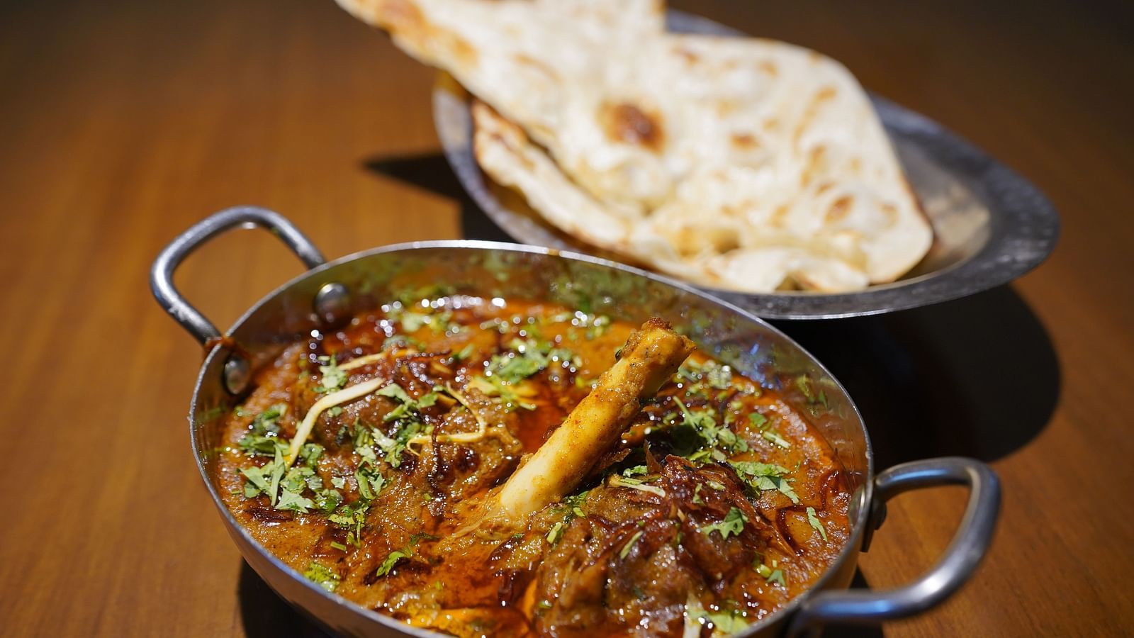 An image of kadhai chicken and naan placed on a table - Argo By Trance, Goa