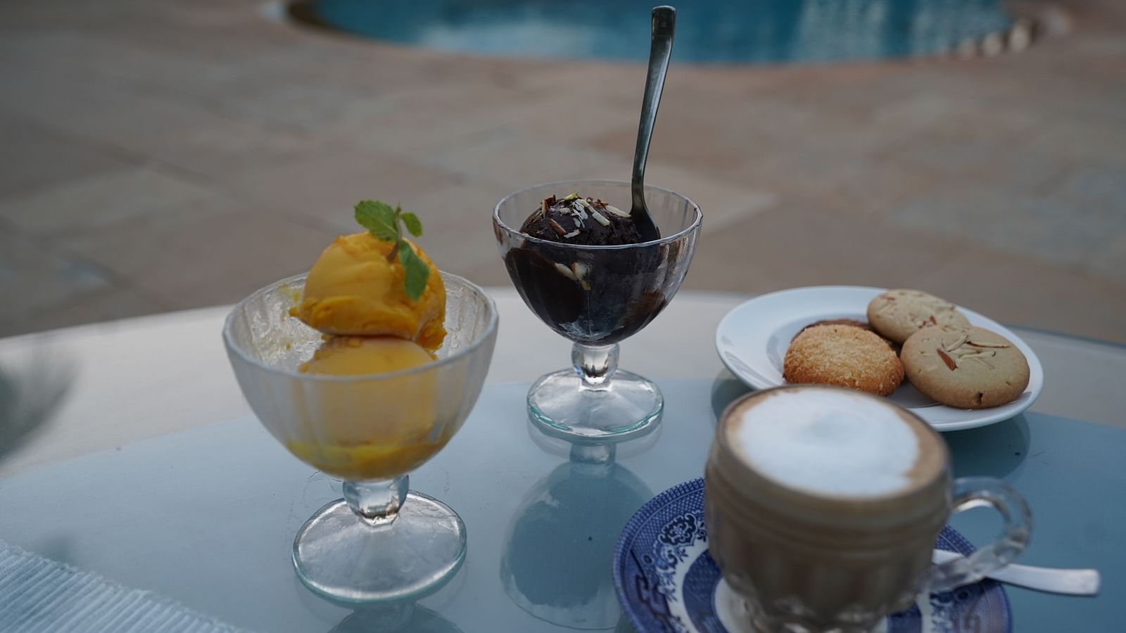 An image of a tea table where ice cream bowls are placed - Argo By Trance, Goa