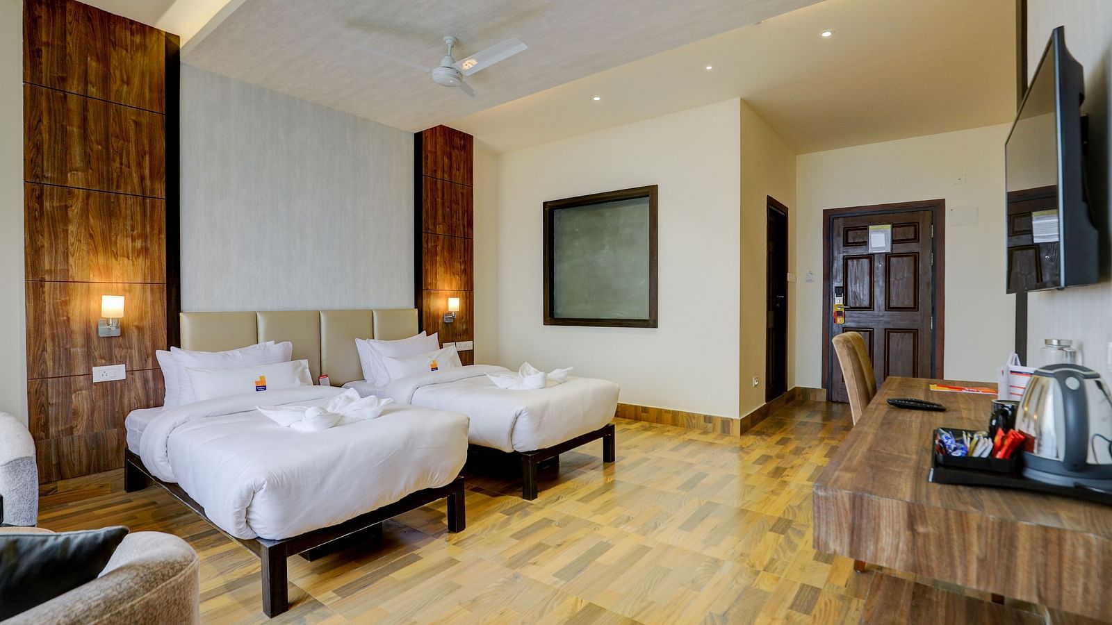 view of twin beds and TV of a Premium Room at Banari Regency by Summit, Namchi