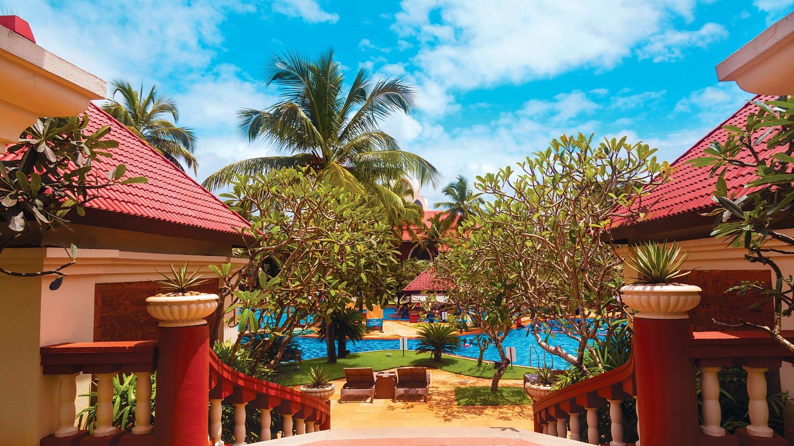 entrance to Caravela Beach Resort Goa with the swimming pool in the background