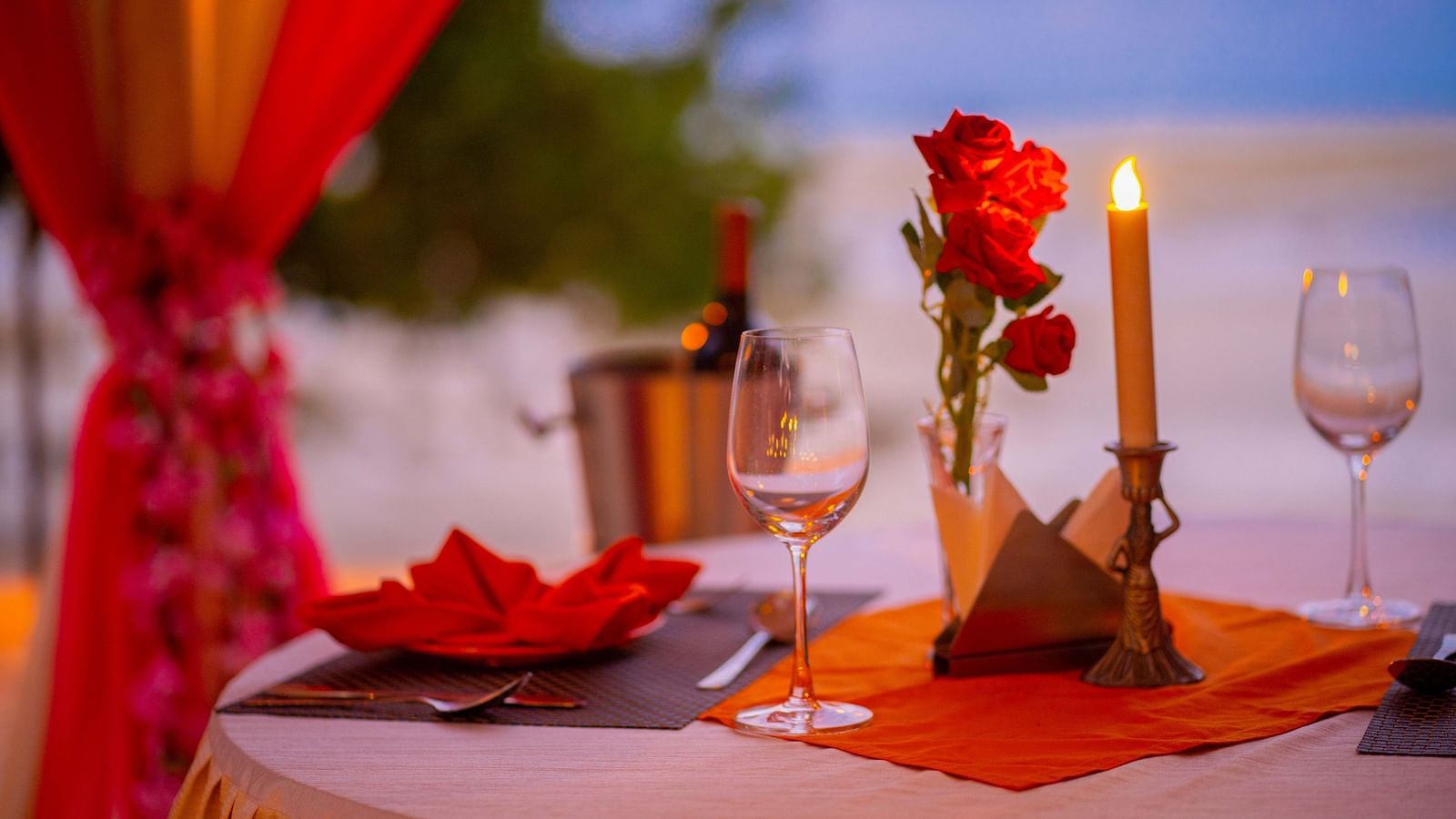 Close up view of candle light dinner at Coral Reef Hotel & Resort