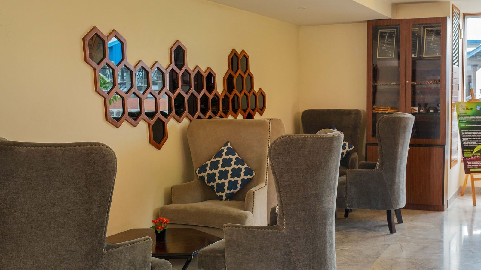 Image of the lounge area at Coral Reef Hotel and Spa in Port Blair featuring recliners and coffee tables