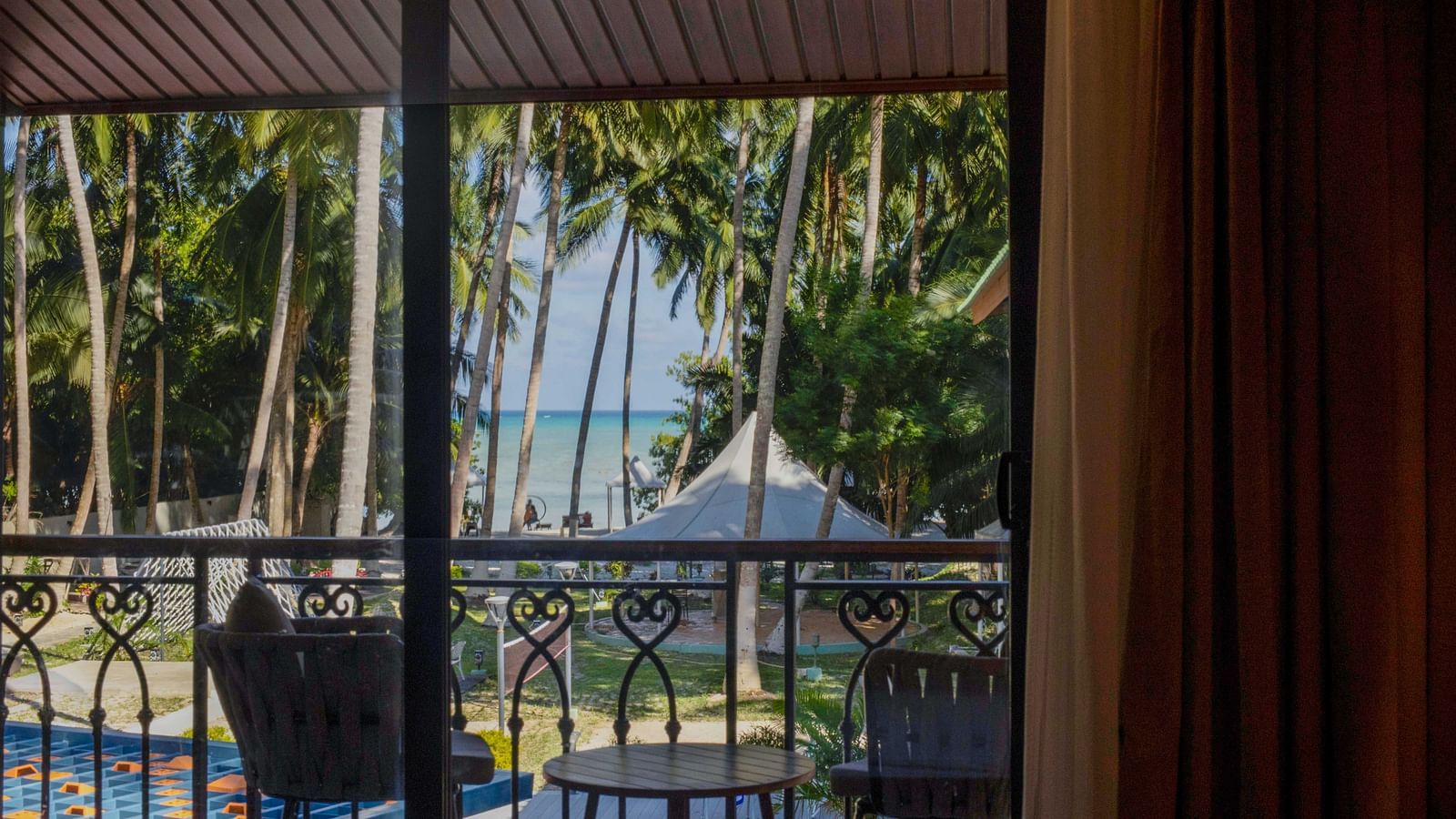 Image of the picturesque view of the nature from the balcony of Coral Teal Suite at Coral Reef Resort and Spa in Havelock