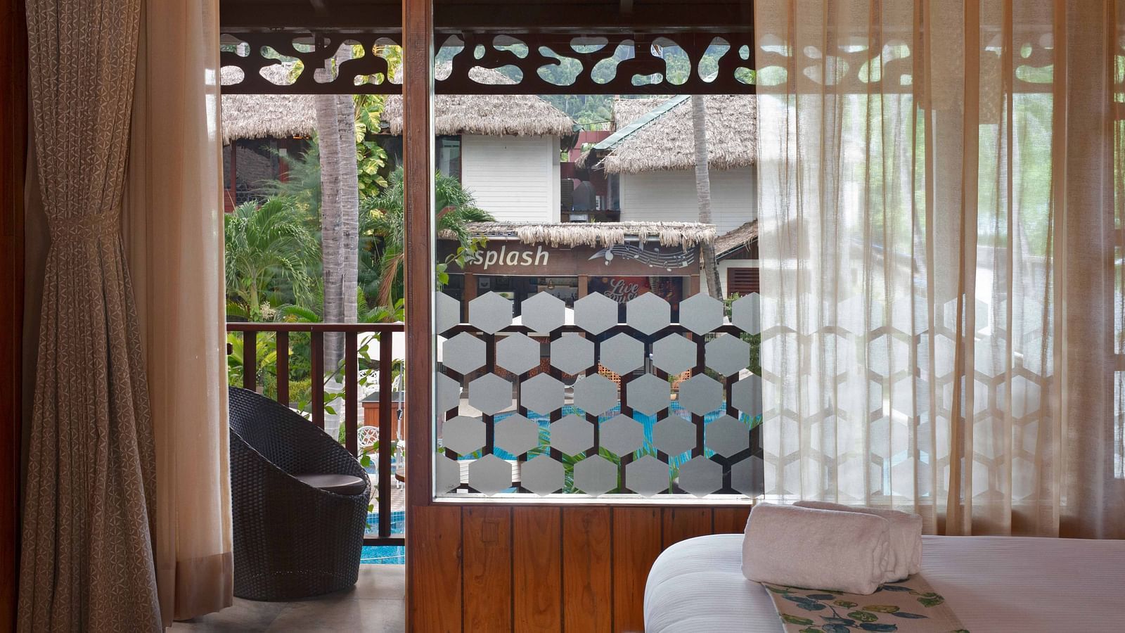 Coral Turquoise at Coral Reef Resort and Spa in Havelock featuring the door3way to the balcony with a seating space with pool view 