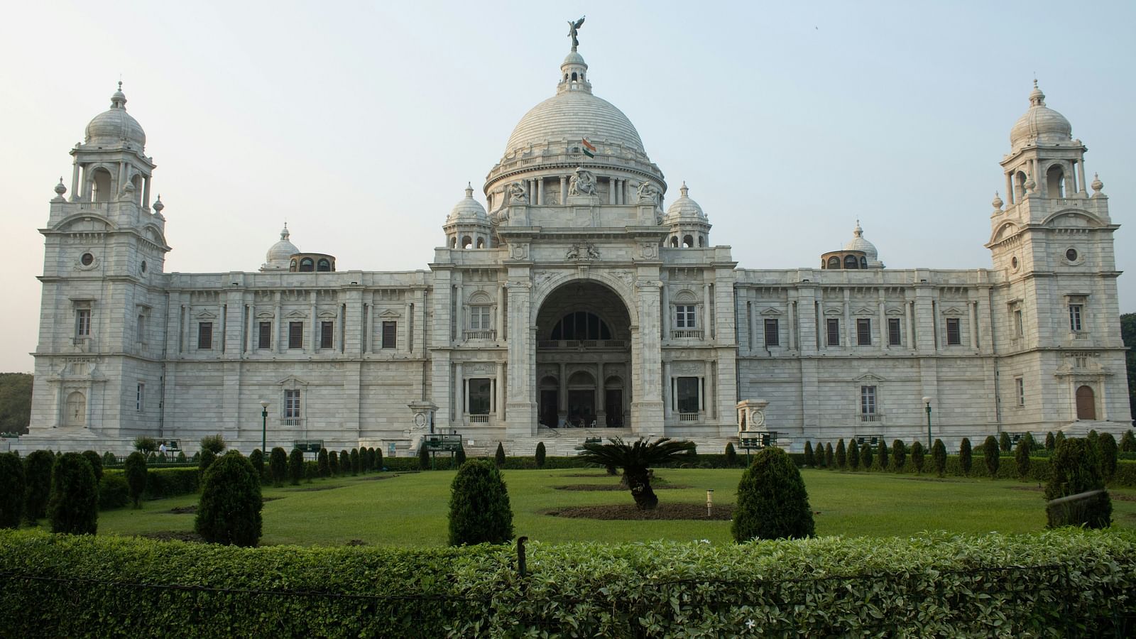 an overview of Victoria Memorial with a manicured garden in front of it
