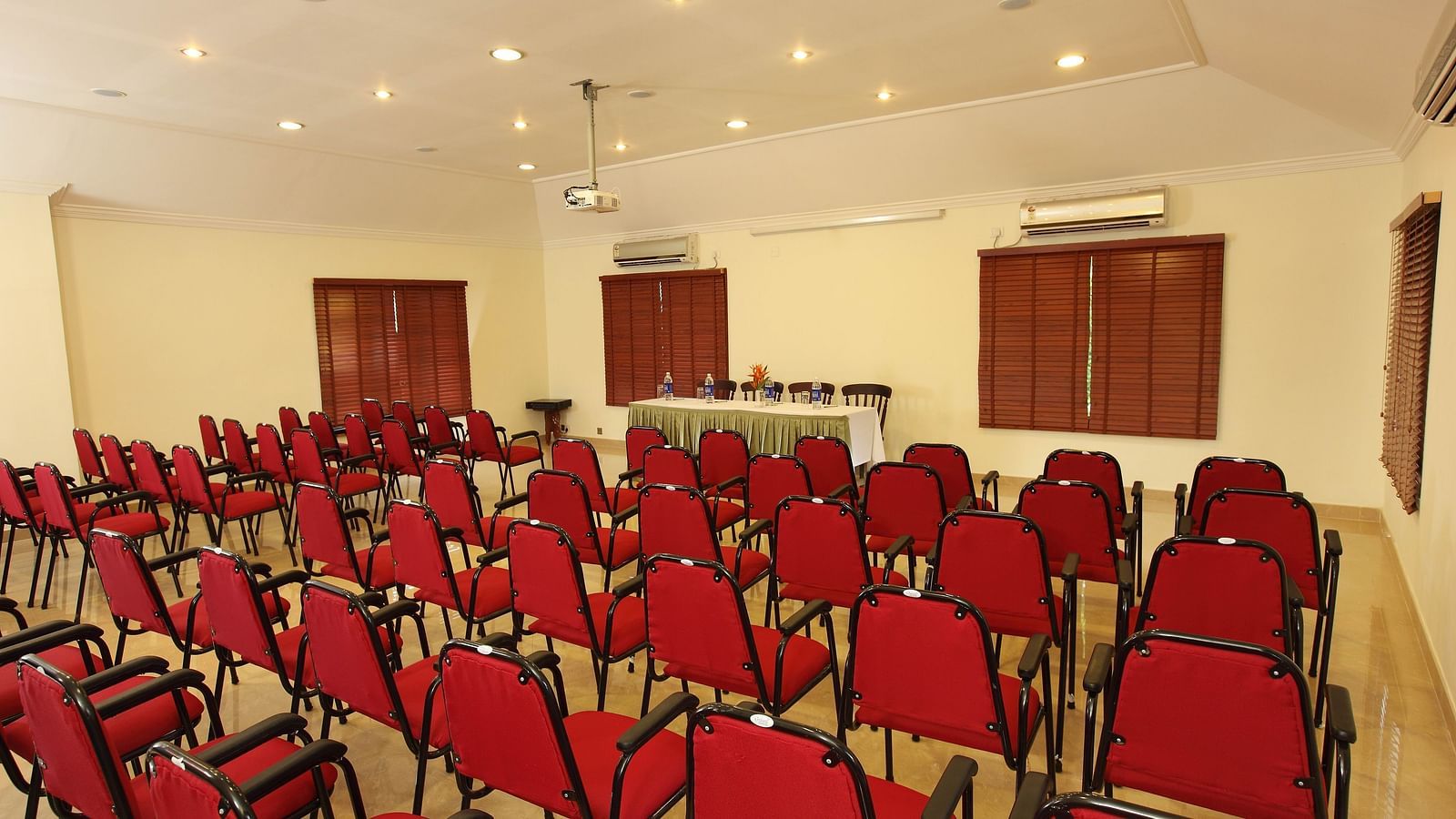 Banquet hall with chairs neatly arranged from the back, ready for the celebration