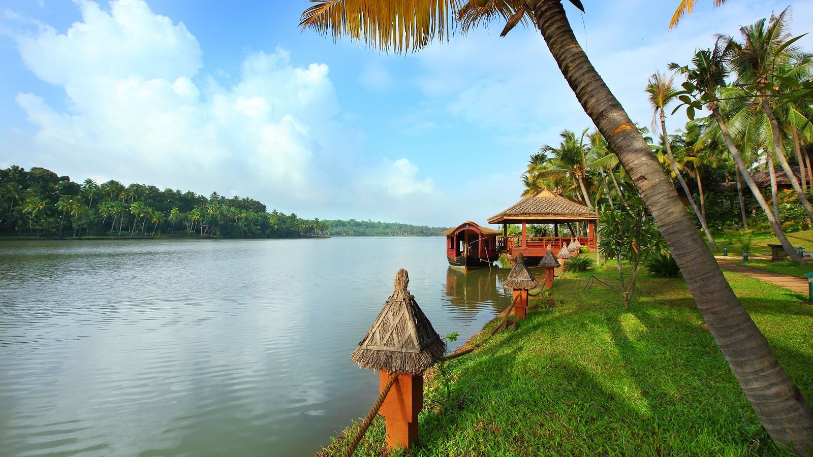  A balcony setup overlooking the lake with a scenic natural view, accessible via a pathway leading to the area