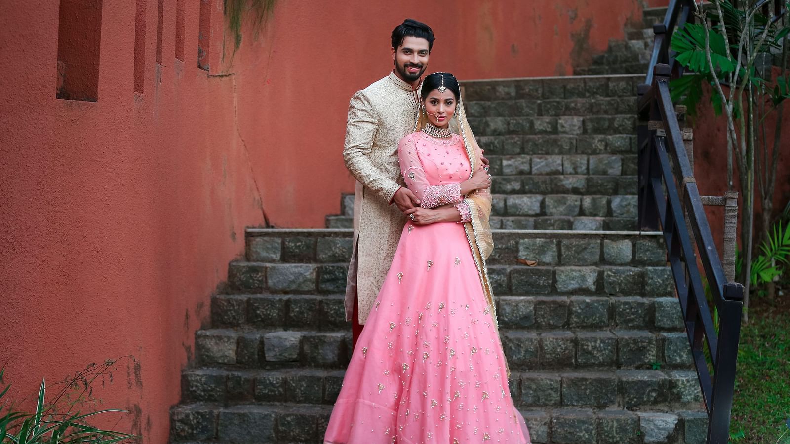 A couple’s wedding photoshoot by the staircase