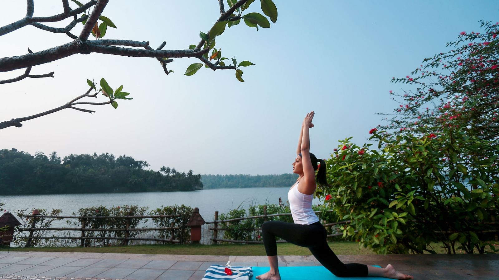 A woman practising yoga on the terrace