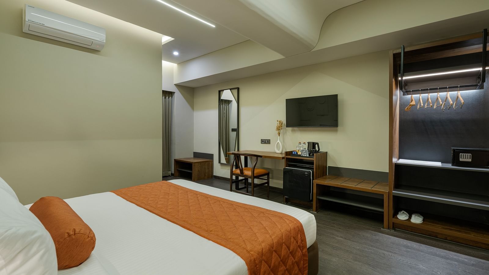 Tangerine Room's spacious interior designed for relaxation, accommodating three adults and a child.