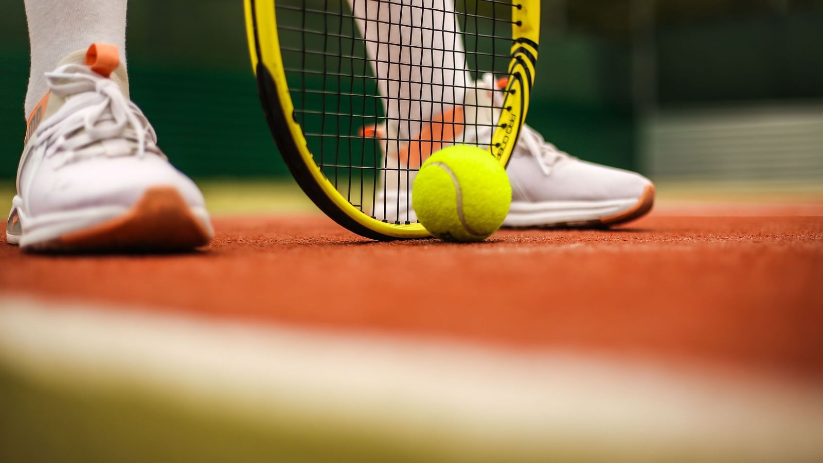 Gamyam Retreat Kumta - A tennis player with a racquet and a ball with him