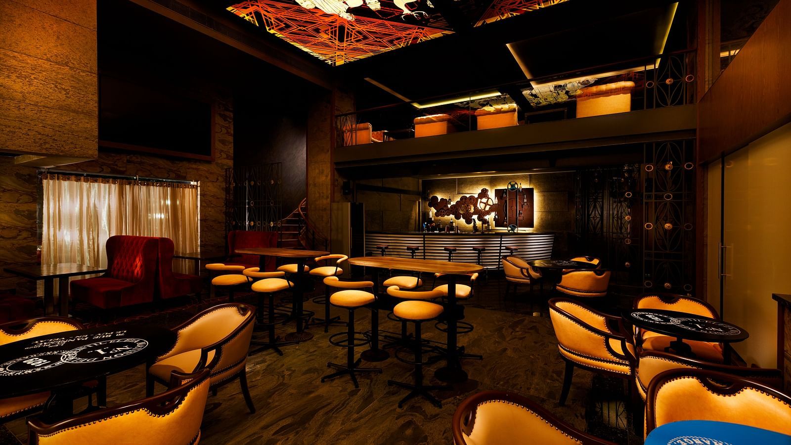 Seating area of Steam and Whistles restaurant at Grand Chennai By GRT Hotels.