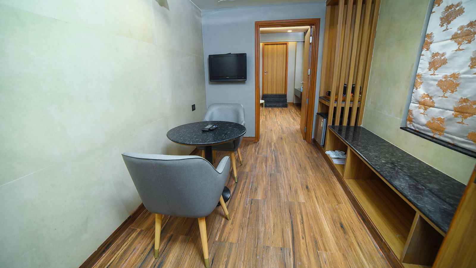 Living room area in the Grand Balcony Room at Grand Palace, Yercaud