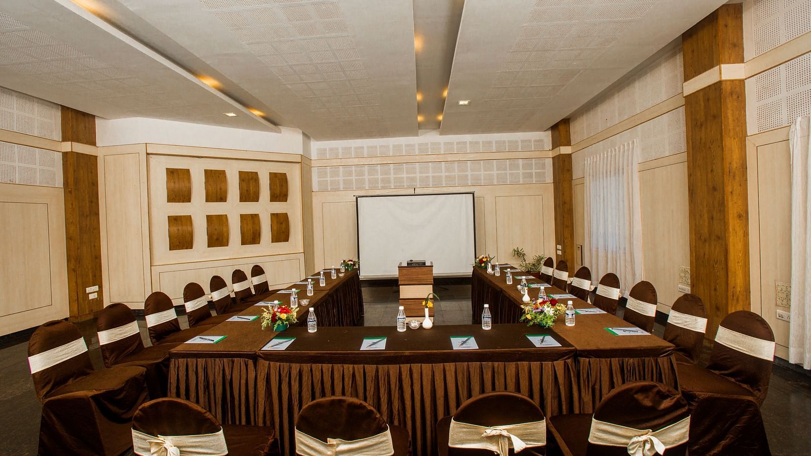image of the Grand two banquet hall with well organised chairs and a conference table at Grand palace, Yercaud