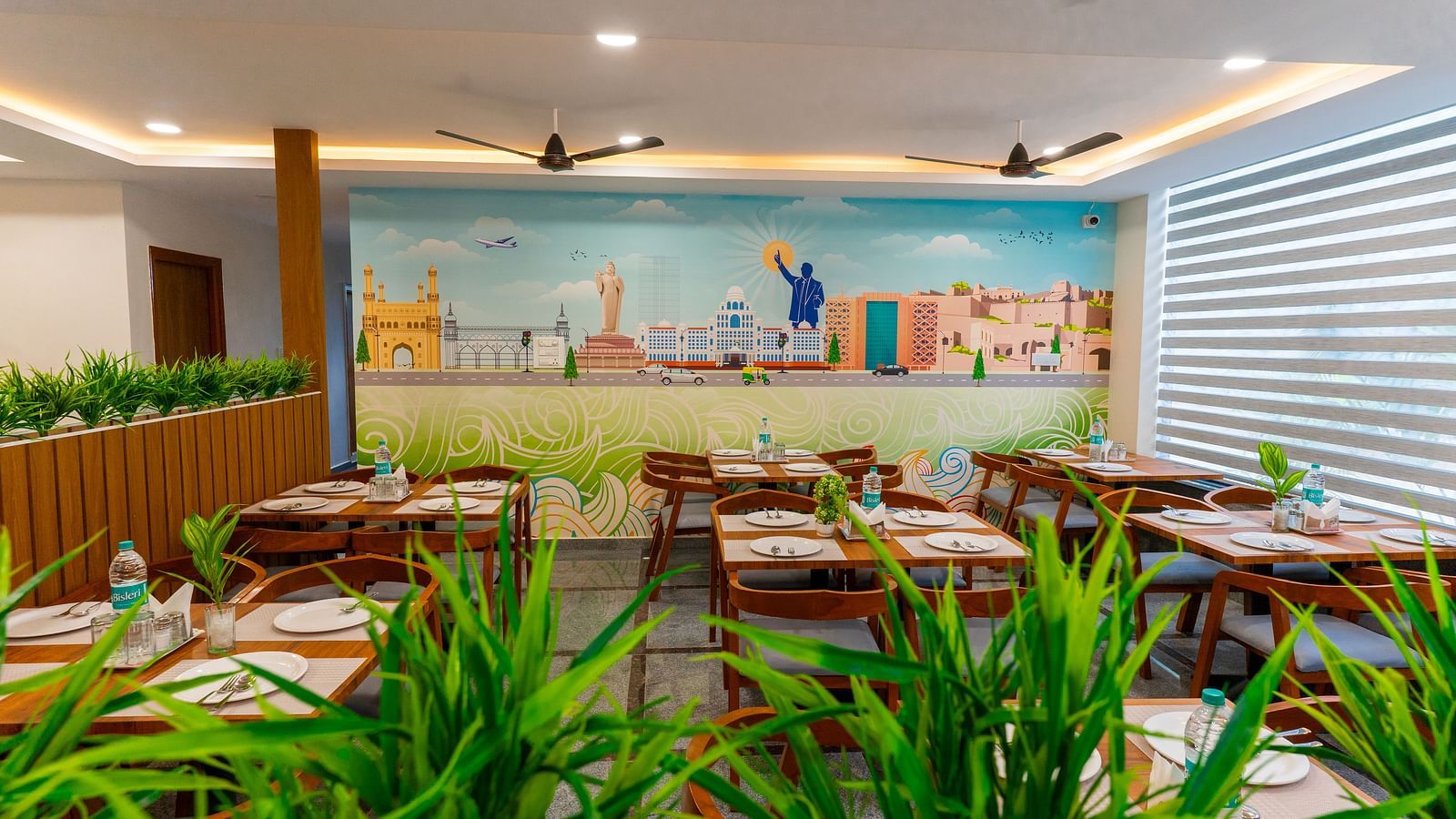 An image of a dinning area which has tables and chairs as a seating arrangement - Hotel Aerotel, Hyderabad - A Unit of Comfort Hometel