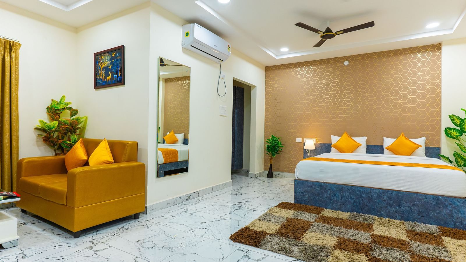 An image of a Suite with sitting area, a king size, AC, fan, etc. Hotel Aerotel, Hyderabad - A Unit of Comfort Hometel