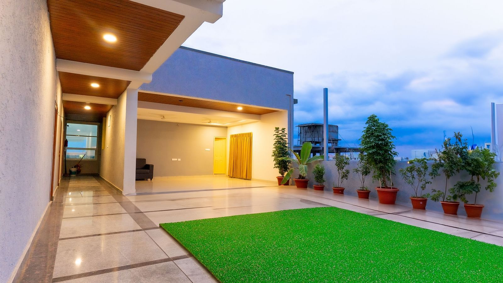 An image of a lawn area in a well lit building - Hotel Aerotel, Hyderabad - A Unit of Comfort Hometel