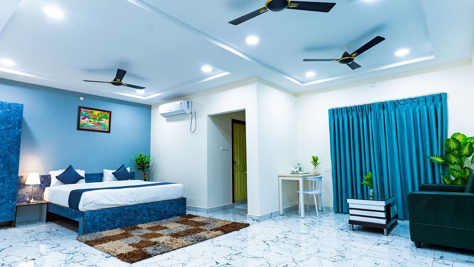 An image of a Suite with sitting area, a king size, AC, fan, etc. Hotel Aerotel, Hyderabad - A Unit of Comfort Hometel