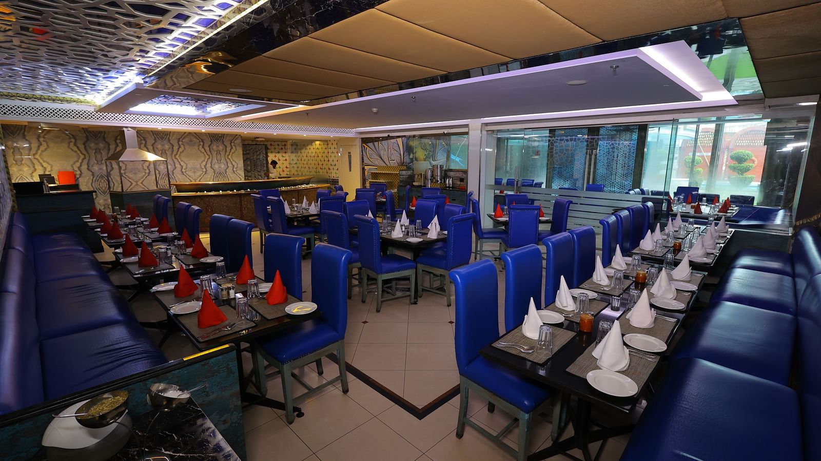 Image of Noor Jahan buffet restaurant with seating arrangement chairs and tables