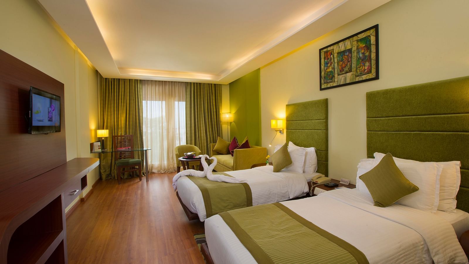 twin beds placed in Superior Room at Hotel Atithi - TGI Grand, Pondicherry