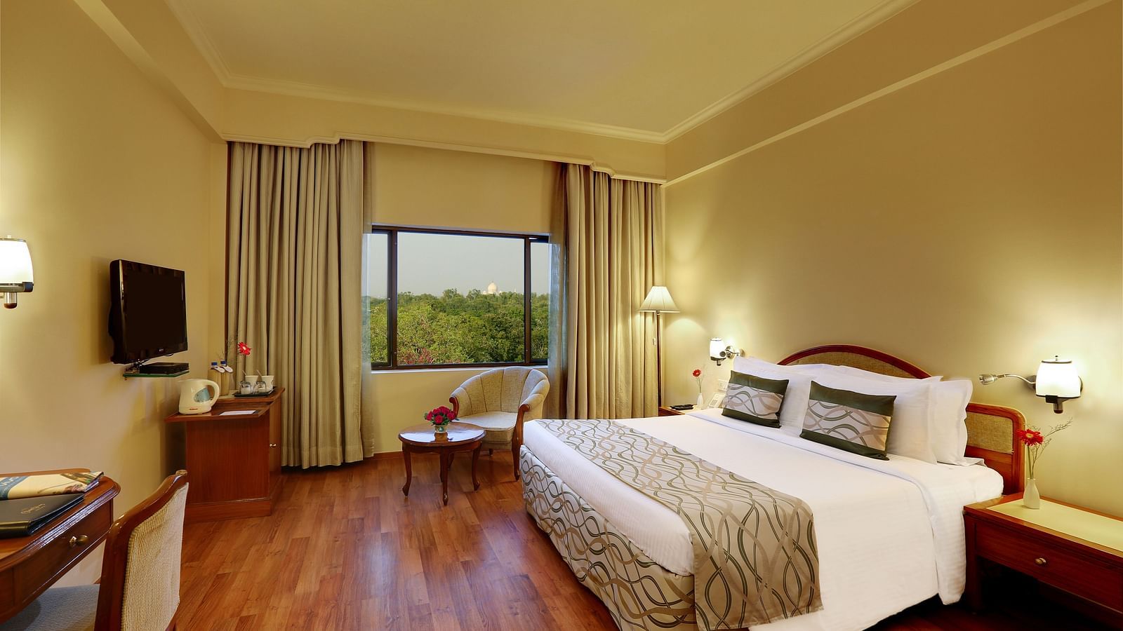 Superior Room at Hotel Clarks Shiraz, Agra with a double bed and a television