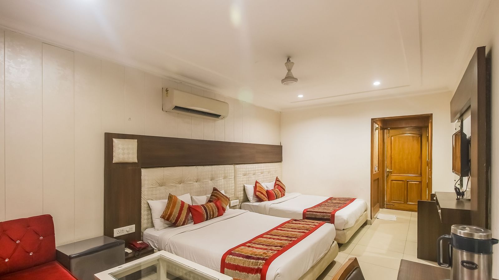 Family Room with two queen size beds, TV, work desk and a seating area - Hotel Diamond Plaza, Chandigarh.