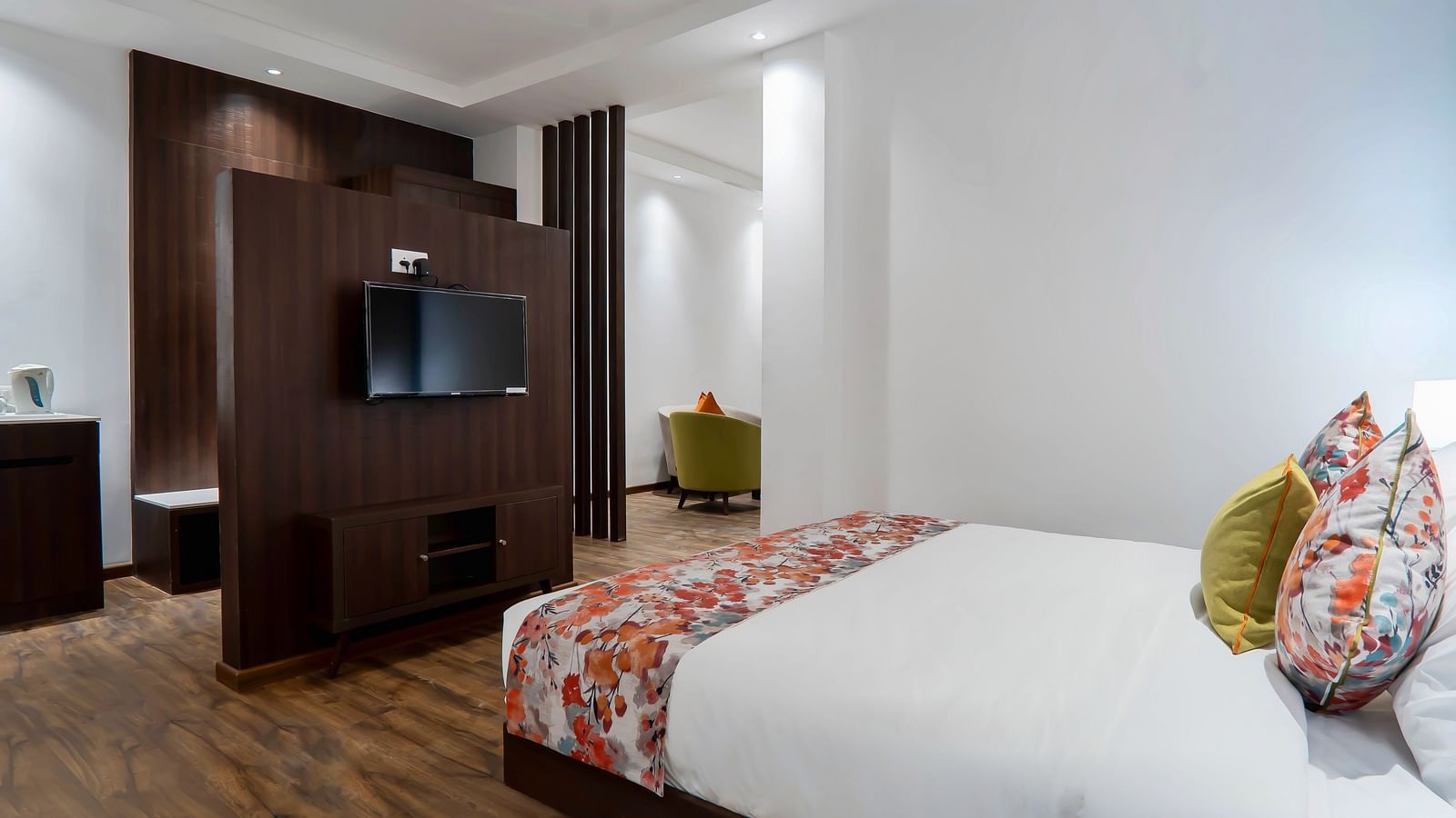 Family Room at Hotel Le ROI Lake View Koti with a sperated TV cabinet and a posh bed for a cosy stay4