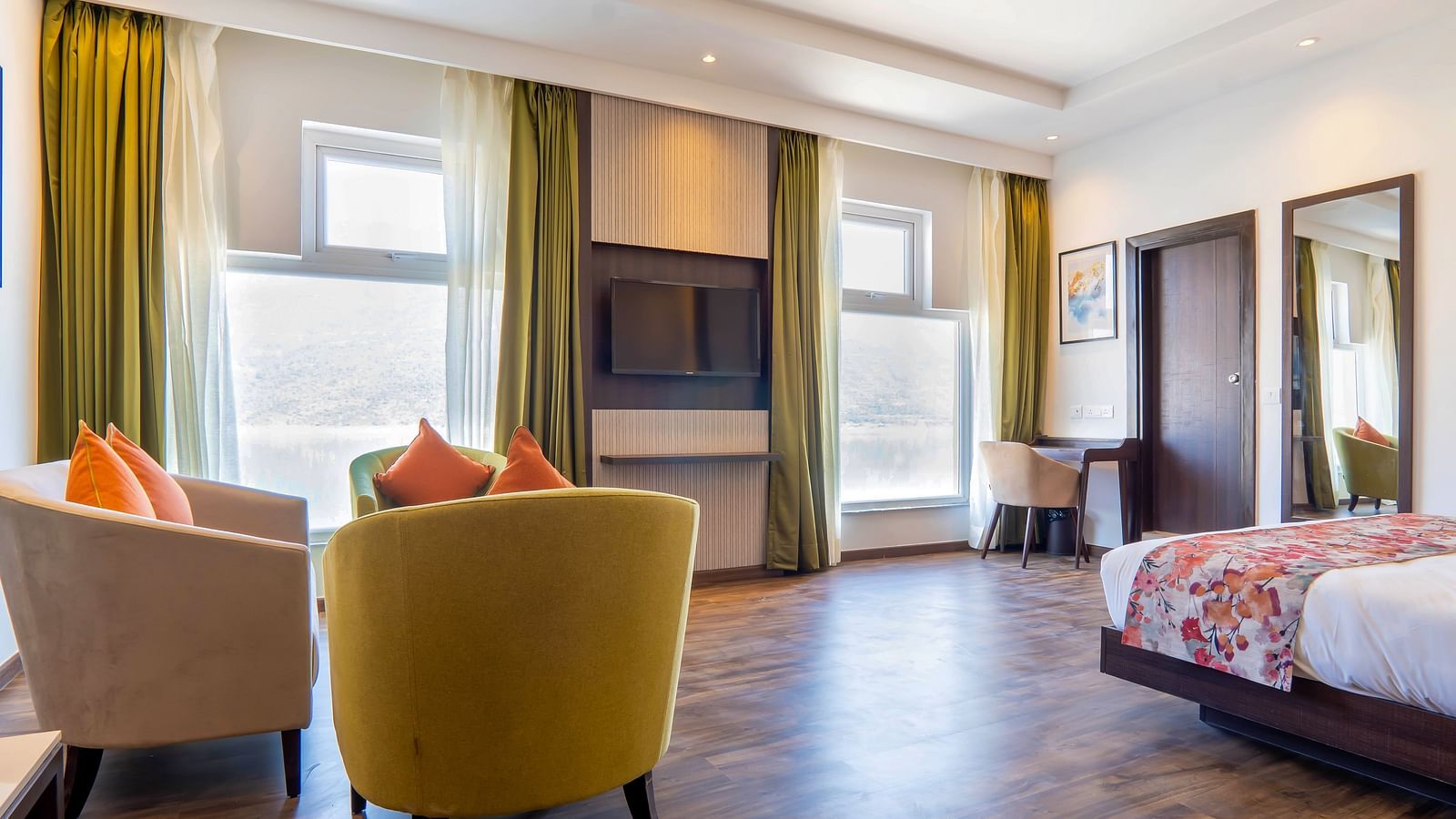 Premium Rooms with Lake View at Hotel Le ROI Lake View Koti with a beautiful view from the window next to the plush bed4