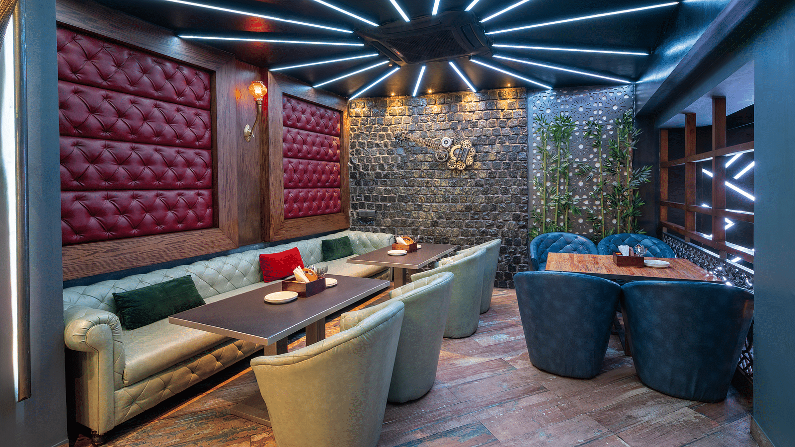 Interior view of the restaurant at Hotel Moti Palace, featuring comfy sofas and warm, ambient lighting