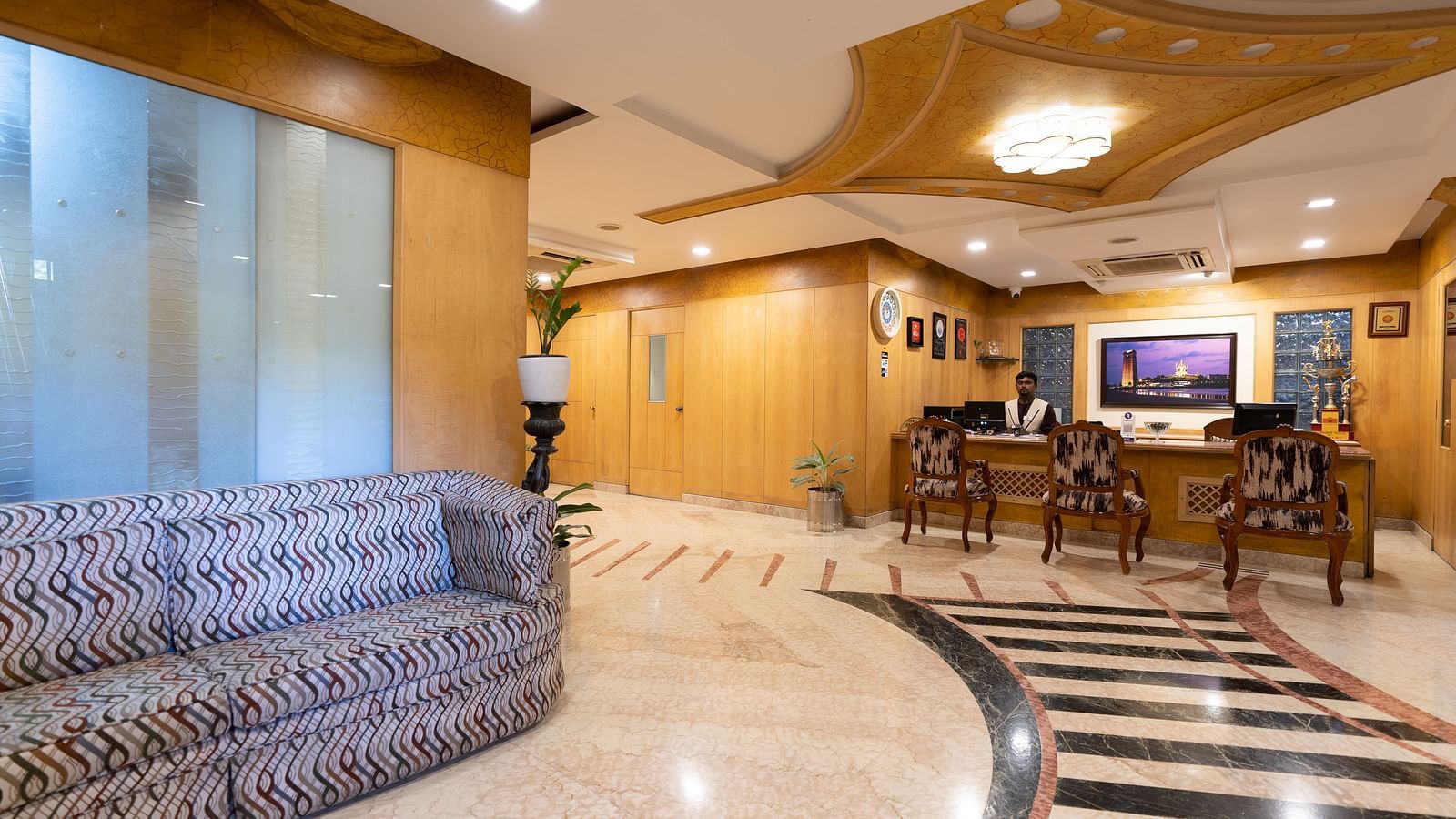 Overview of the lobby with seating arrangements - Hotel Pai Comforts, JP Nagar