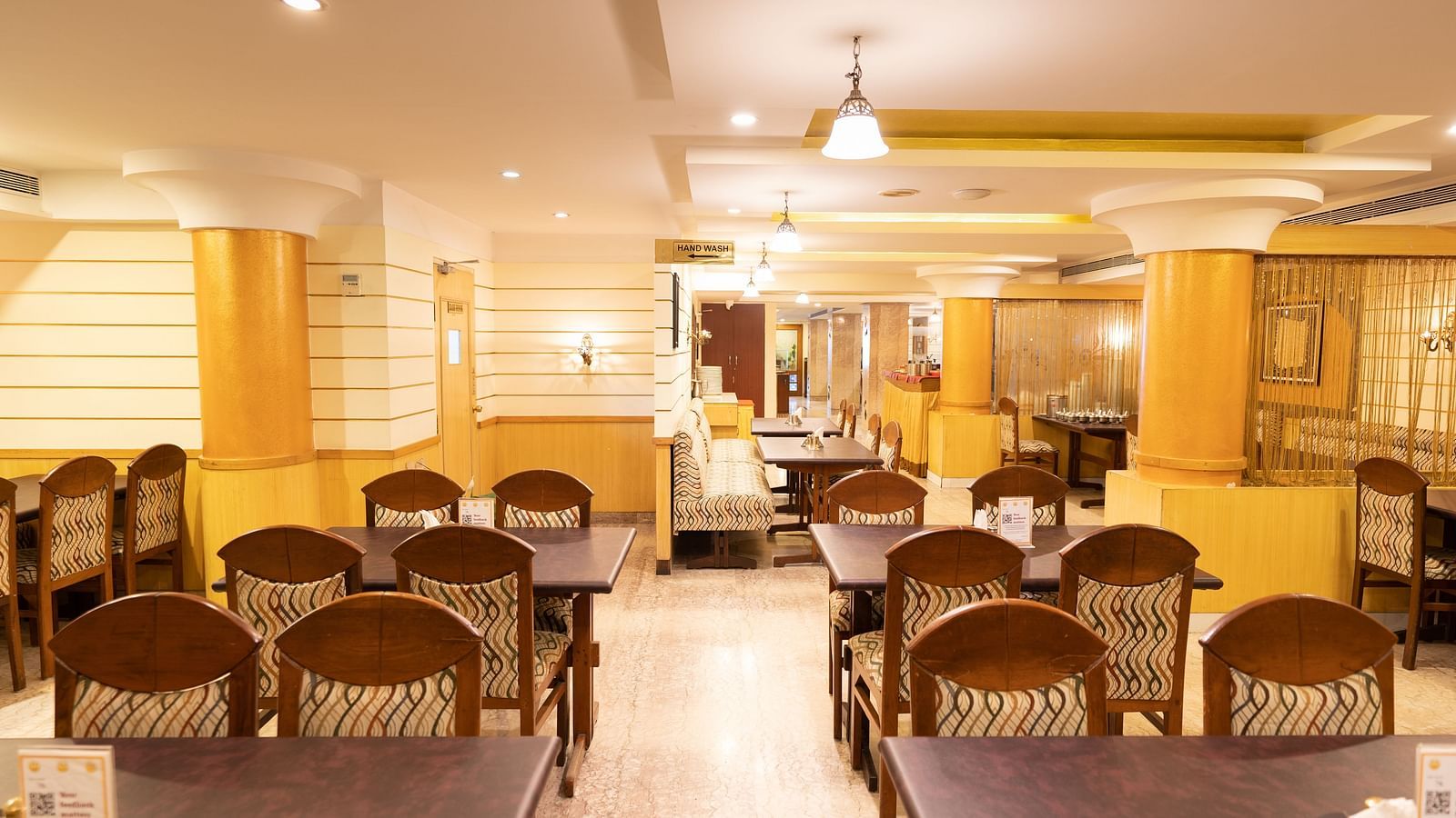 Seating arrangements inside the restaurant - Hotel Pai Comforts, JP Nagar