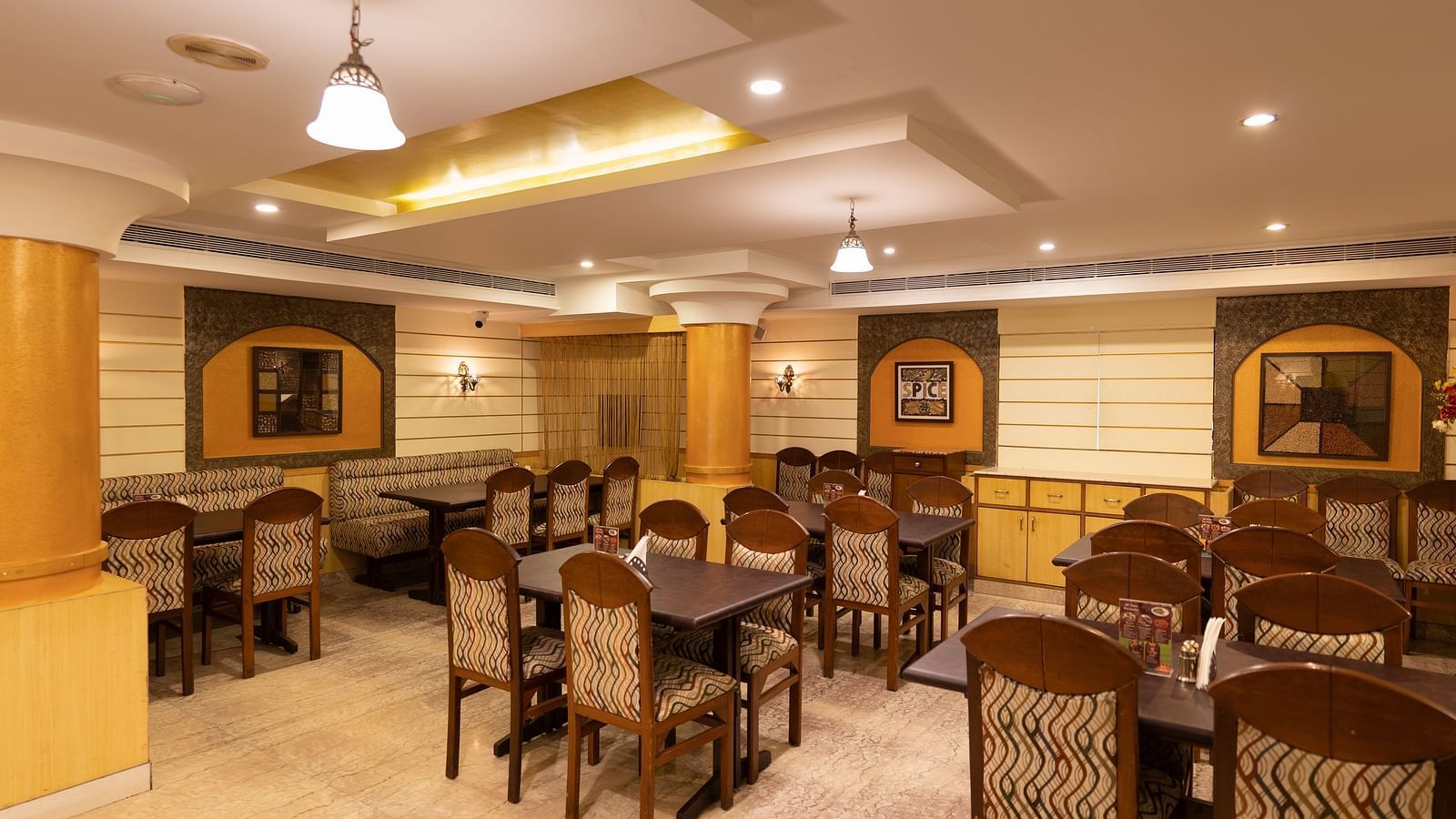 Seating arrangements inside the restaurant - Hotel Pai Comforts, JP Nagar