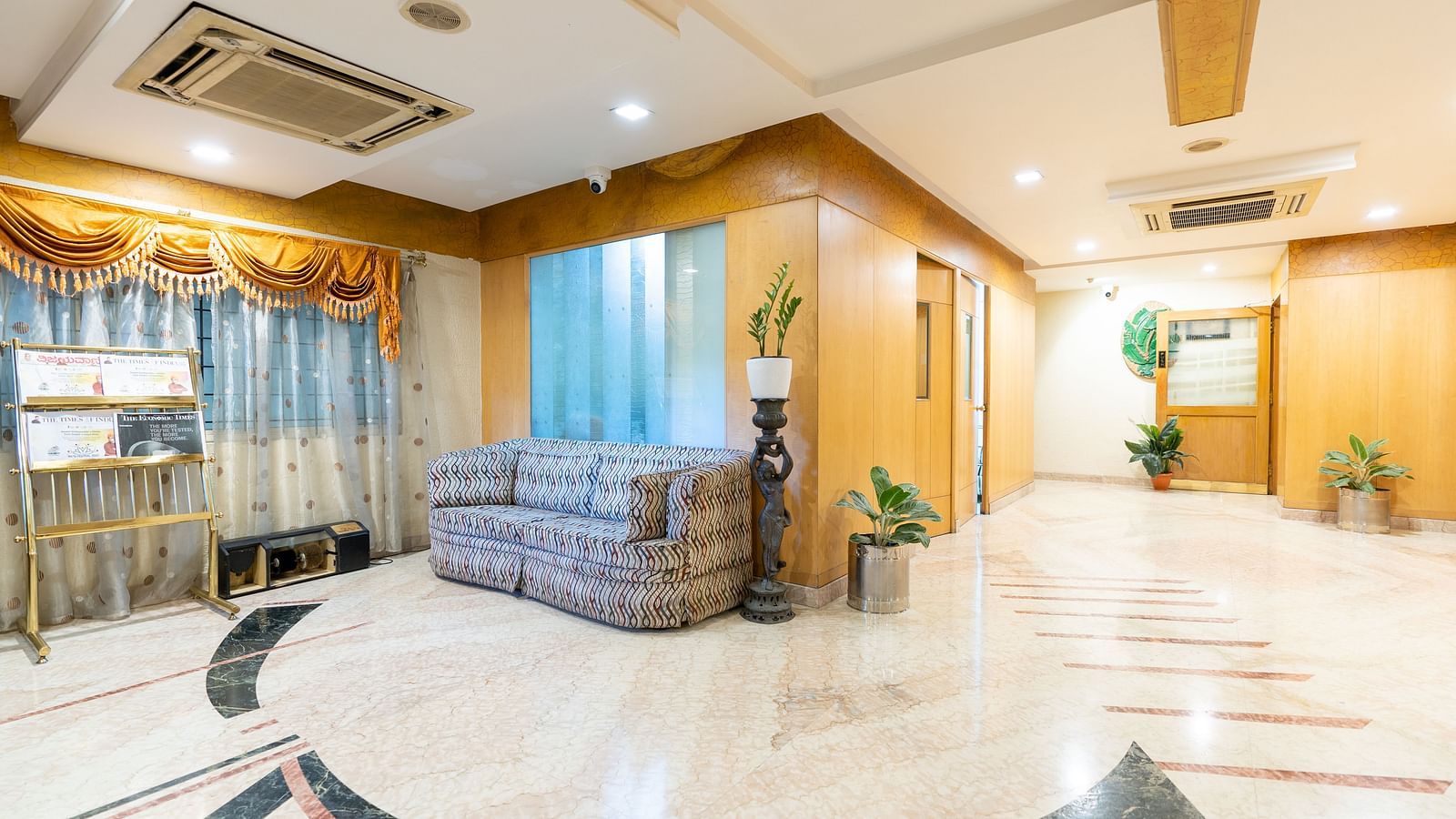 Overview of the lobby with seating arrangements - Hotel Pai Comforts, JP Nagar