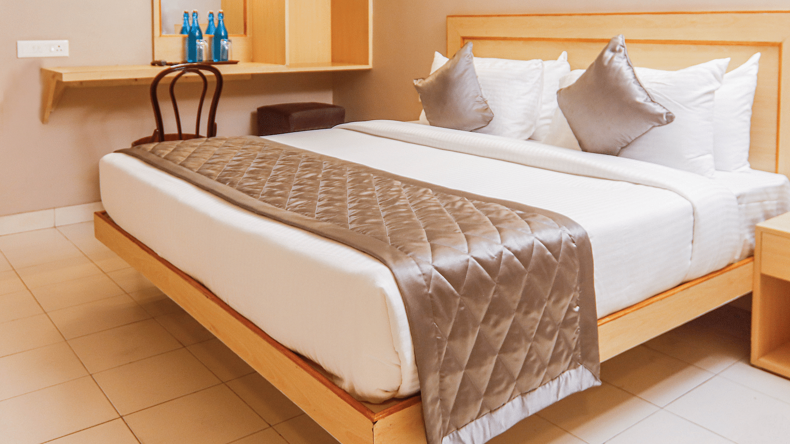 view of king size bed of a Deluxe Room at at Hotel Vinayaga, Tiruppur