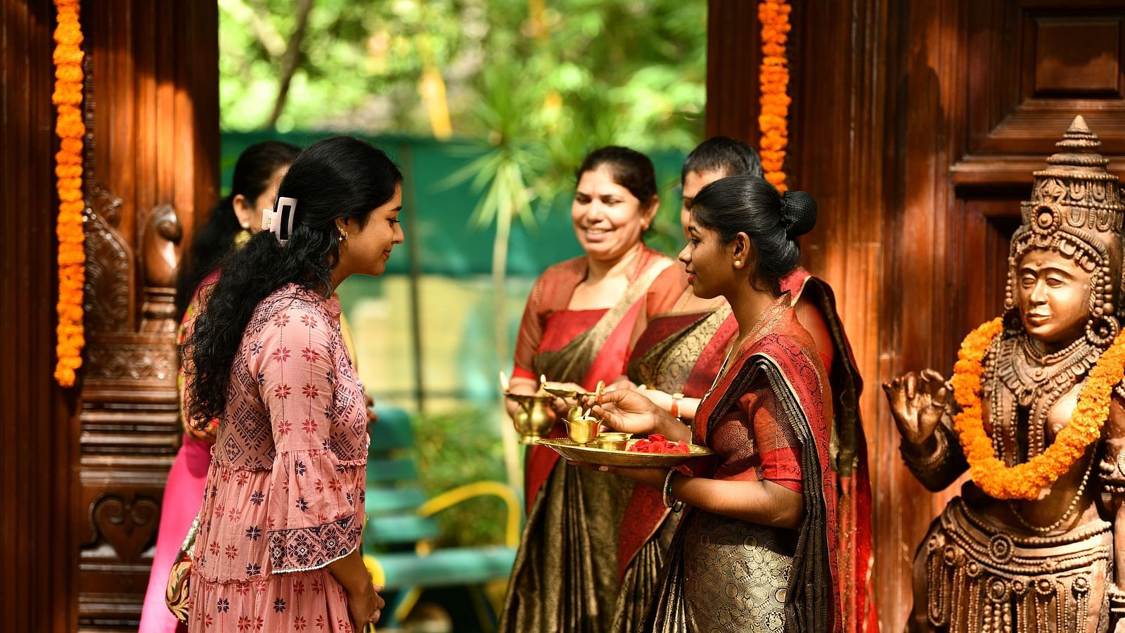 staff welcoming the guests at hoysala village resort, hassan
