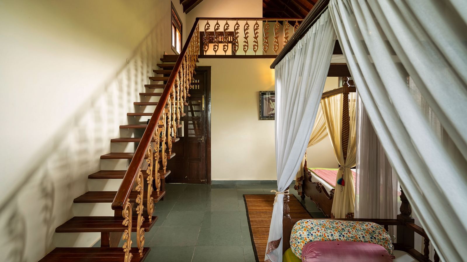 image of a staircase going up at the malnad attic suite at hoysala village resort, hassan