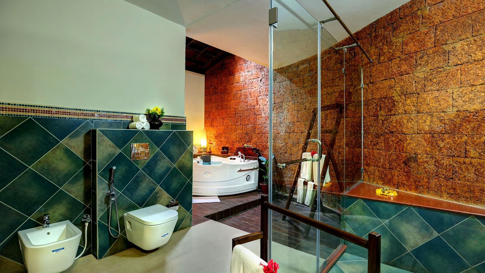 An image of a western style bathroom with showerheads, glass, fauctes, buckets, and other functionalities - Hoysala Village Resort, Hassan