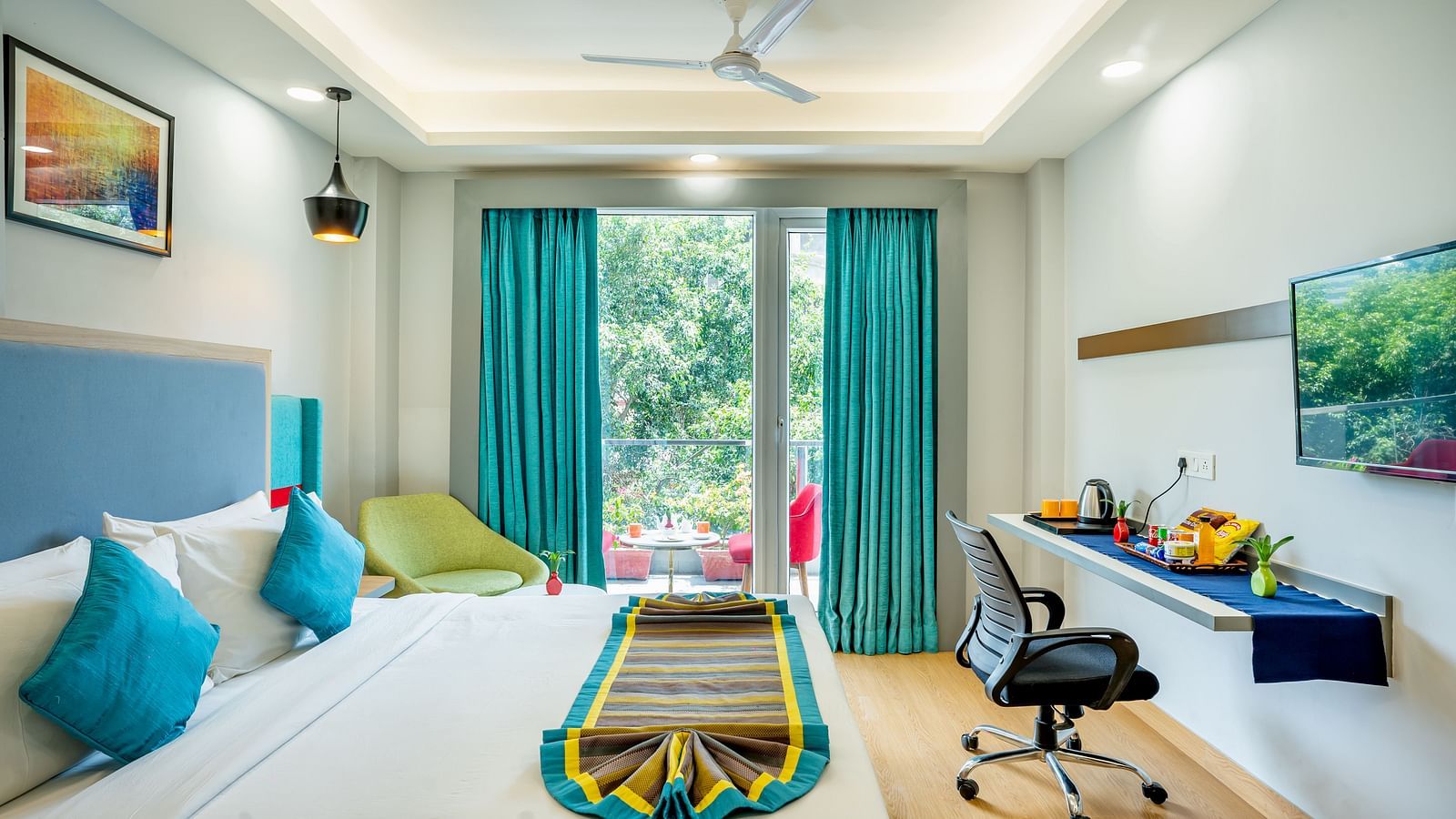 An image of a bedroom with balcony | Inde Hotel Golf Course Extension