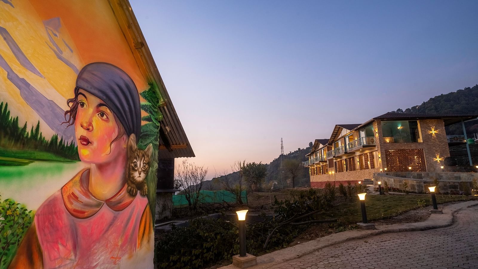 Exterior of Infinitea Retreat Bir with Wall Art