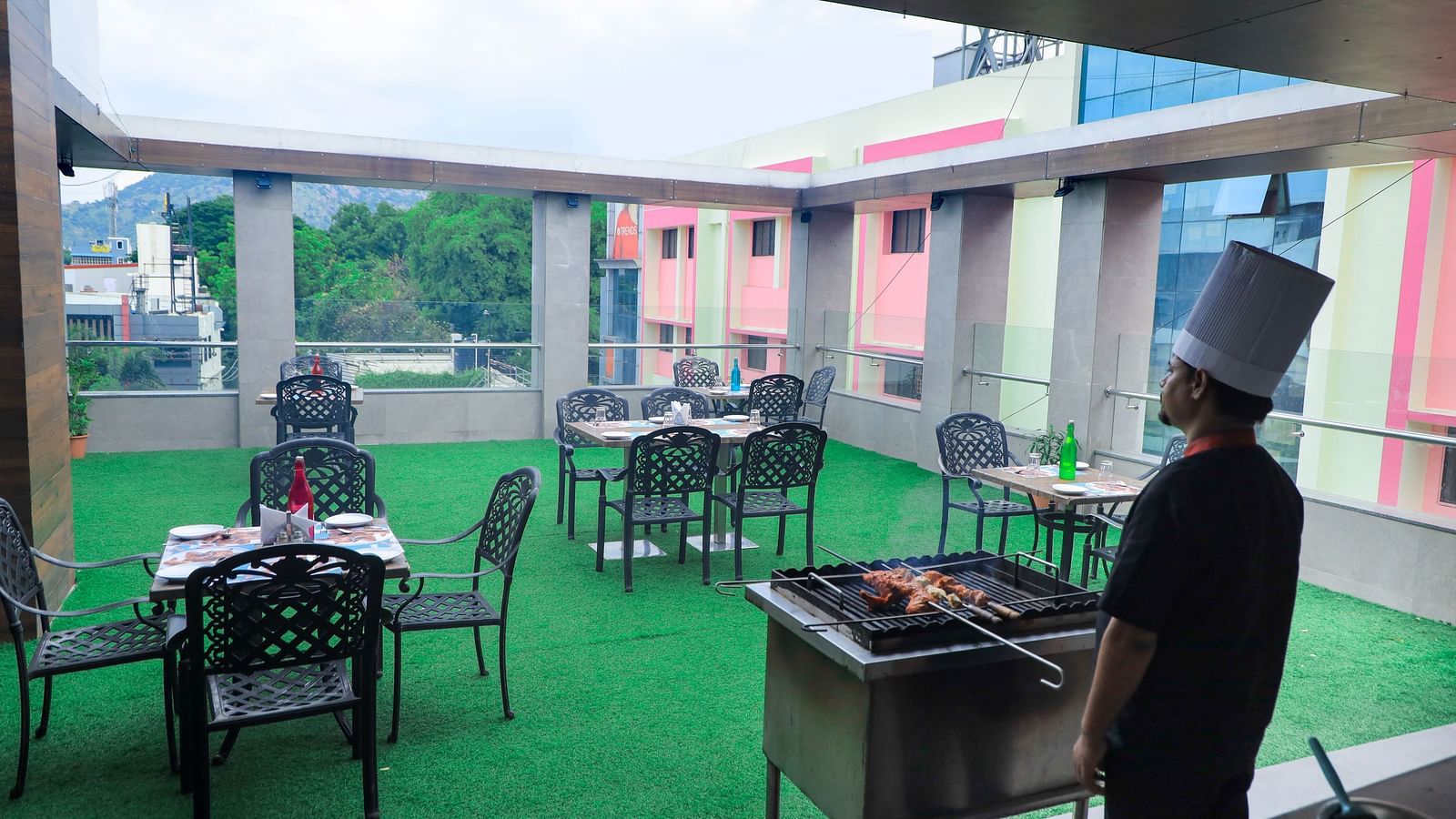 Palate -BBQ Skydine Restaurant where chef is making BBQ during the evening time
