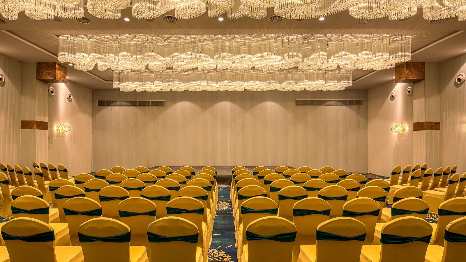 Yellow coloured chairs in the Sumo Anaika Banquet Hall at Le Foliage by TGI, Bangalore