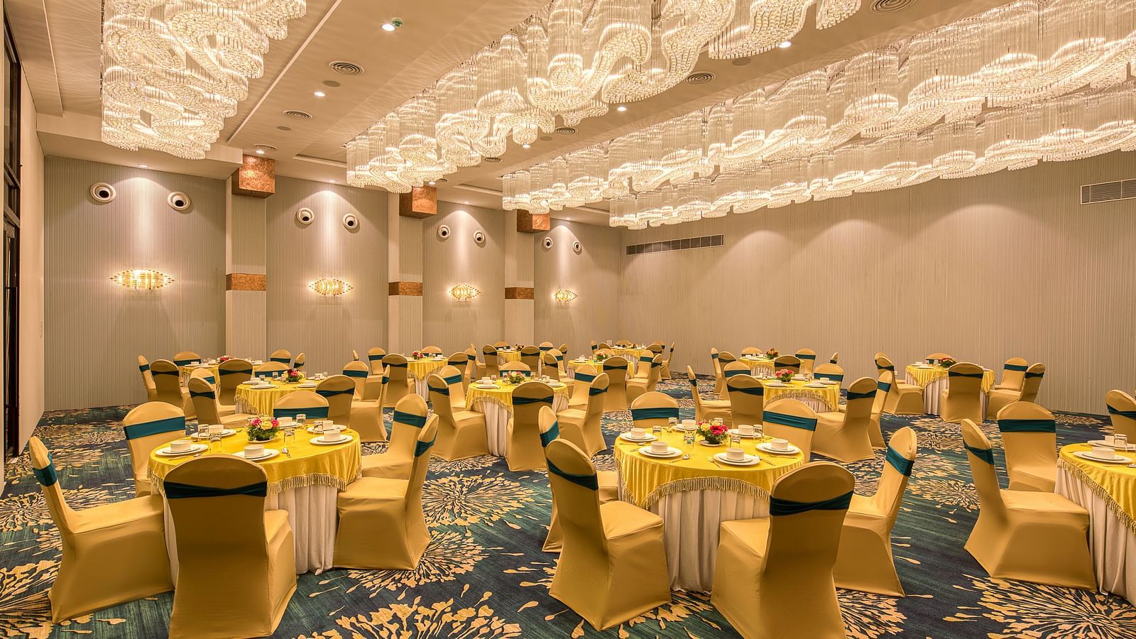 Yellow coloured chairs in the Sumo Anaika Banquet Hall at Le Foliage by TGI, Bangalore