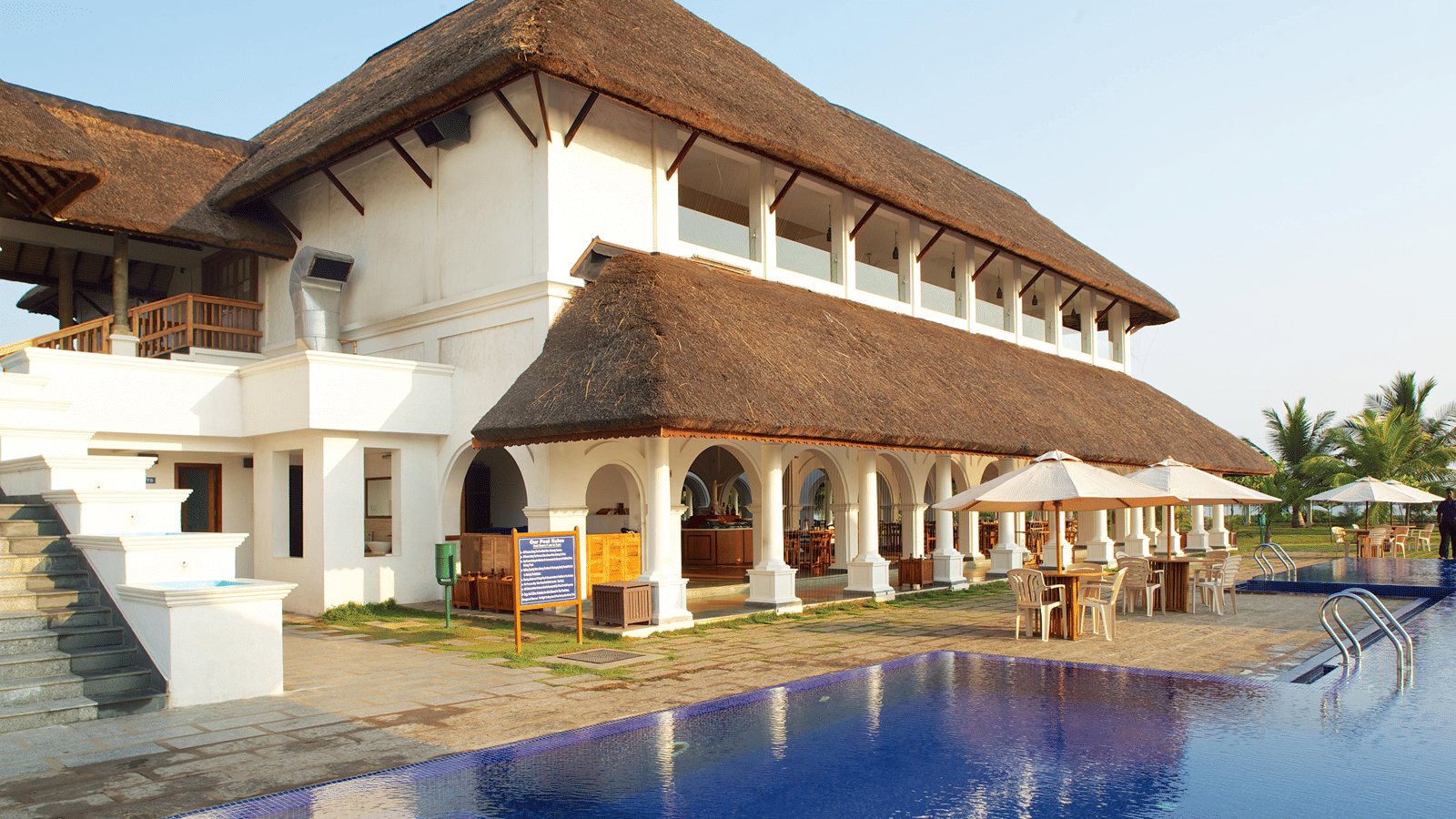 Thatched-roof building beside the pool