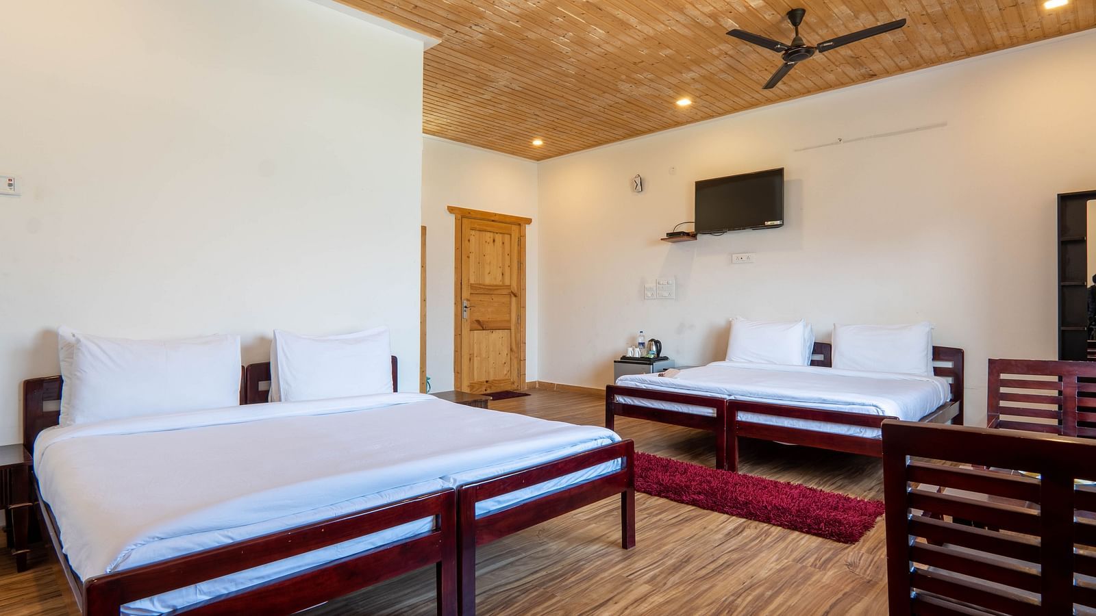 Family Room On Land closeup view of posh bedding and white duvet - Le ROI Floating Huts Eco Rooms2